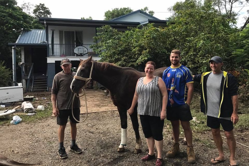 Tilly with her rescuers