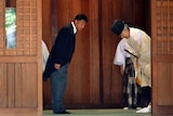 Yoshitaka Shindo leaves the Yasukuni Shrine in Tokyo the 68th anniversary of Japan's defeat in WWII.