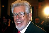 Rolf Harris has been named as the Australian arrested over abuse allegations.