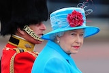 Britain's Queen Elizabeth sits with Prince Philip as they leave Buckingham Palace.