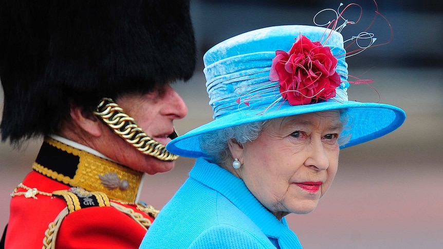 Britain's Queen Elizabeth sits with Prince Philip as they leave Buckingham Palace.