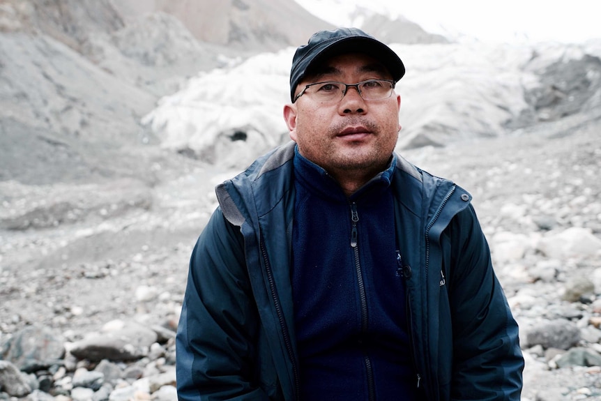 Professor Qin Xiang, one of China’s leading glaciologists, stands on the glacier in Tiger Valley