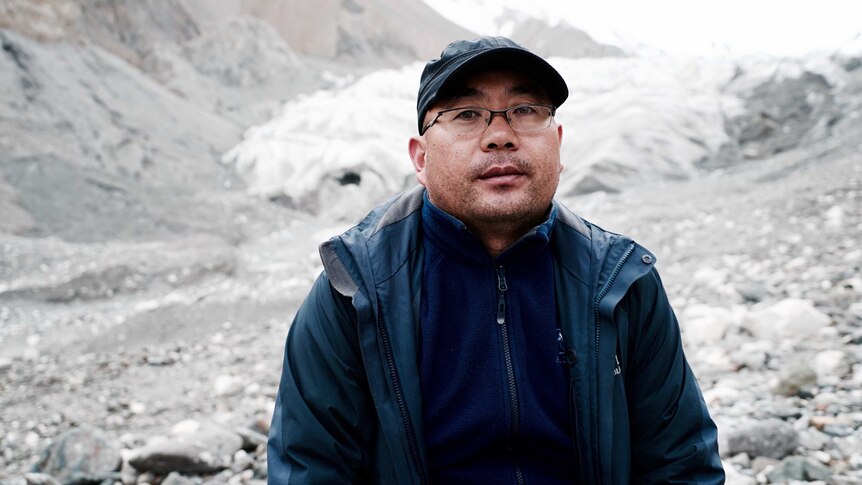 Professor Qin Xiang, one of China’s leading glaciologists, stands on the glacier in Tiger Valley