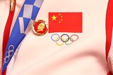 A badge of the late Chinese chairman Mao Zedong was pinned to the tracksuits of gold medallists Bao Shanju and Zhong Tianshi