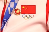 A badge of the late Chinese chairman Mao Zedong was pinned to the tracksuits of gold medallists Bao Shanju and Zhong Tianshi