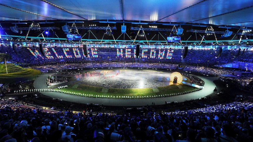 A packed London Stadium celebrates the opening ceremony of the 2012 Olympic Games.