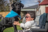 Melbourne woman Alexis Smith with her assistance dog, Opal.