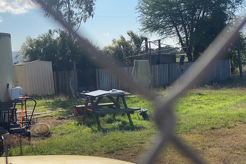 Back yard of house with wooden fence around pool where four-year-old Tarrin-Macen O’Sullivan was found dead.