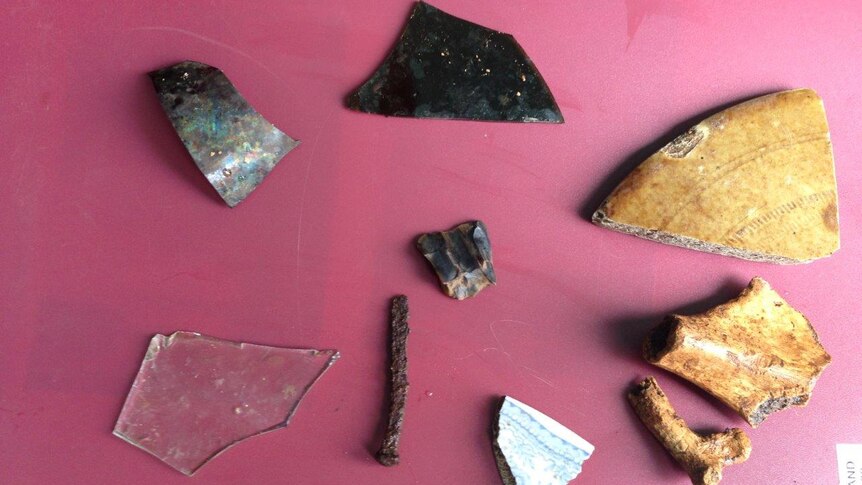 Items found during the dig at Kerry Lodge including glass, nails, gun flint and china
