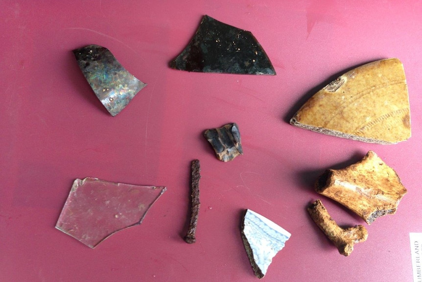 Items found during the dig at Kerry Lodge including glass, nails, gun flint and china