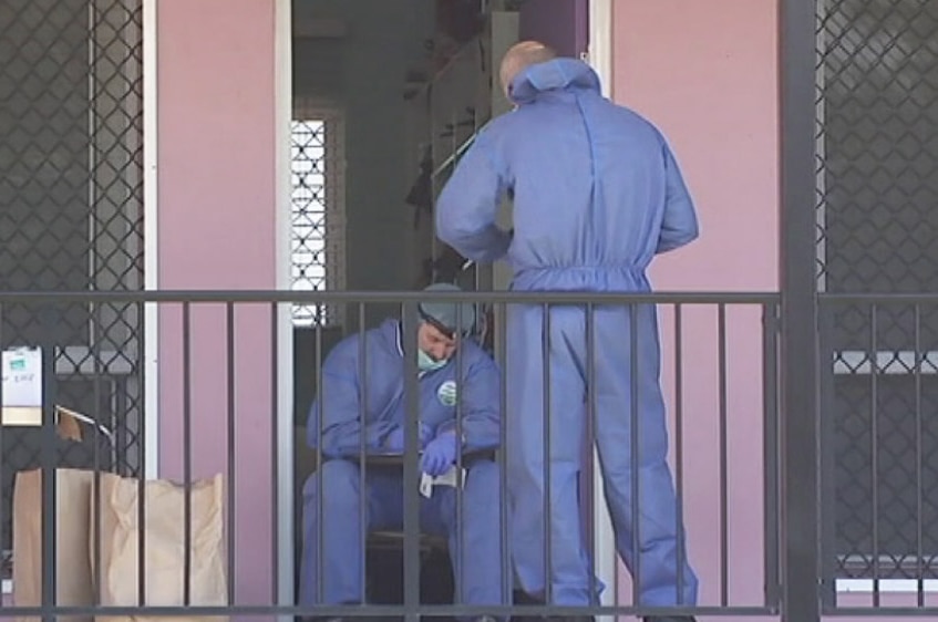 Forensic officers at the scene of a fatal stabbing at Shelley's Backpackers in Home Hill