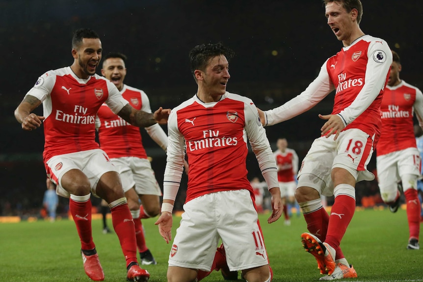 Mesut Ozil celebrates goal against Stoke