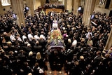 Pallbearers leave St Andrew's Cathedral with the coffin of Constable William Crews