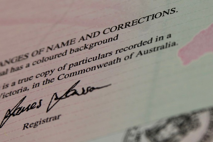 The end of a birth certificate finishes a sentence with 'in the Commonweath of Australia', missing the 'l'.