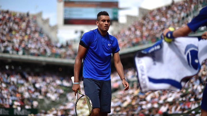 Nick Kyrgios reaches for a towel at French Open