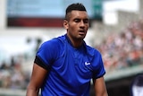 Nick Kyrgios reaches for a towel at French Open