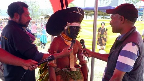 Interview of man in traditional dress - PNG Pacific Games
