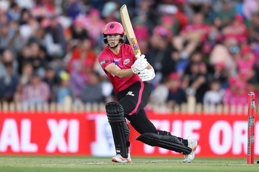 A Sydney Sixers WBBL player hits to the leg side.