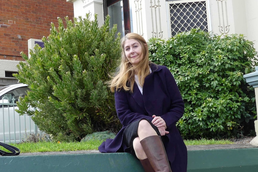 Stephanie Kirkman Meikle sits outside Bethlehem house