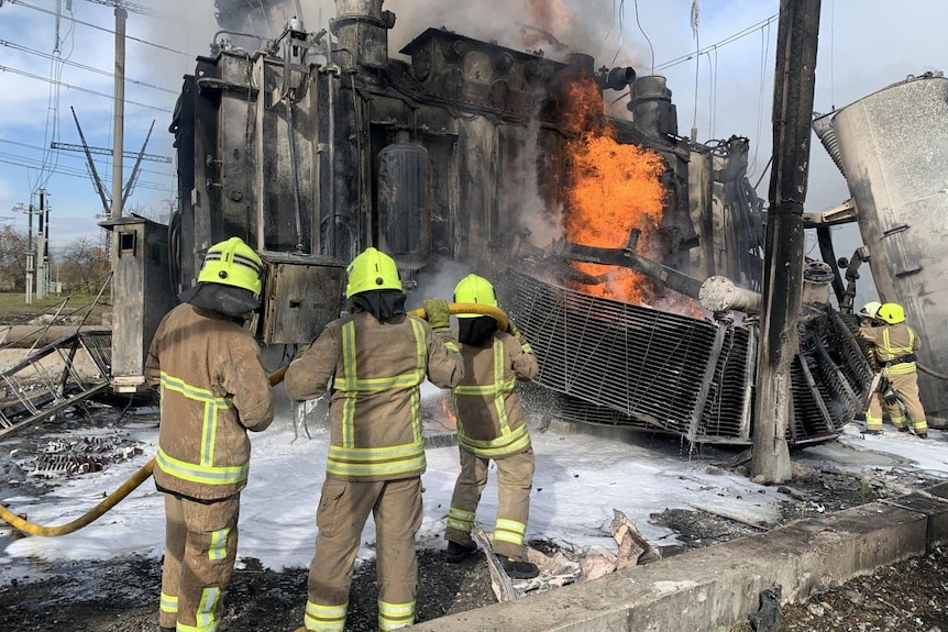 Firefighters work to put out a fire at the small energy facility.