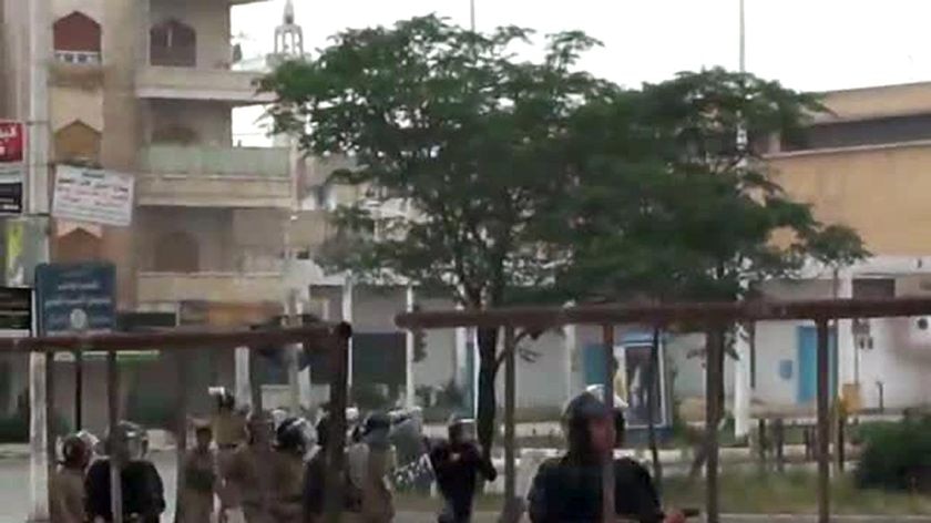 An image grab taken from a video posted on YouTube on May 20, 2011 shows Syrian soldiers running after anti-regime protesters during a demonstration in Hama, north of Damascus.