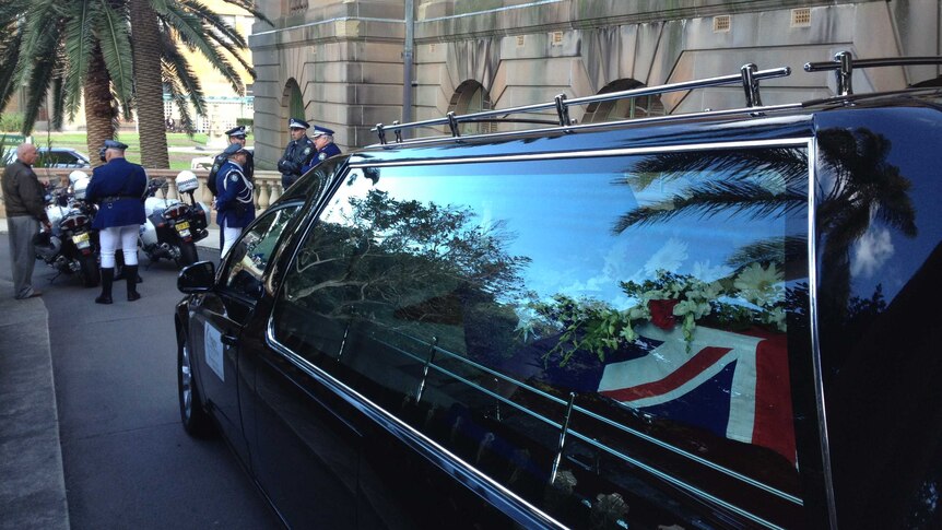 The hearse carrying Senior Constable Tony Tamplin's coffin outside Newcastle City Hall.