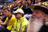 Port Kembla steel workers attend a union meeting in Wollongong