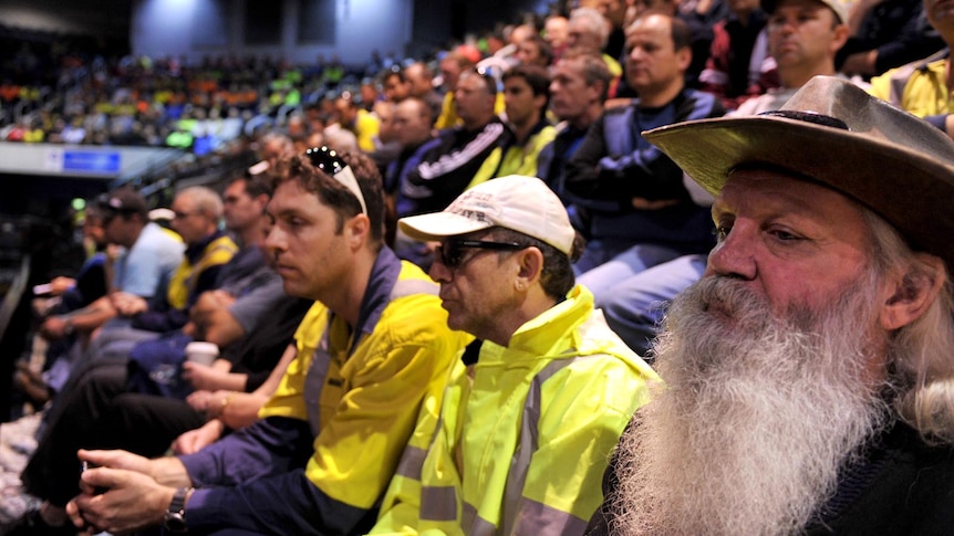 Port Kembla steel workers attend a union meeting in Wollongong