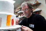Baker Jack Phillips decorates a cake in his Masterpiece Cakeshop in Lakewood, Colorado