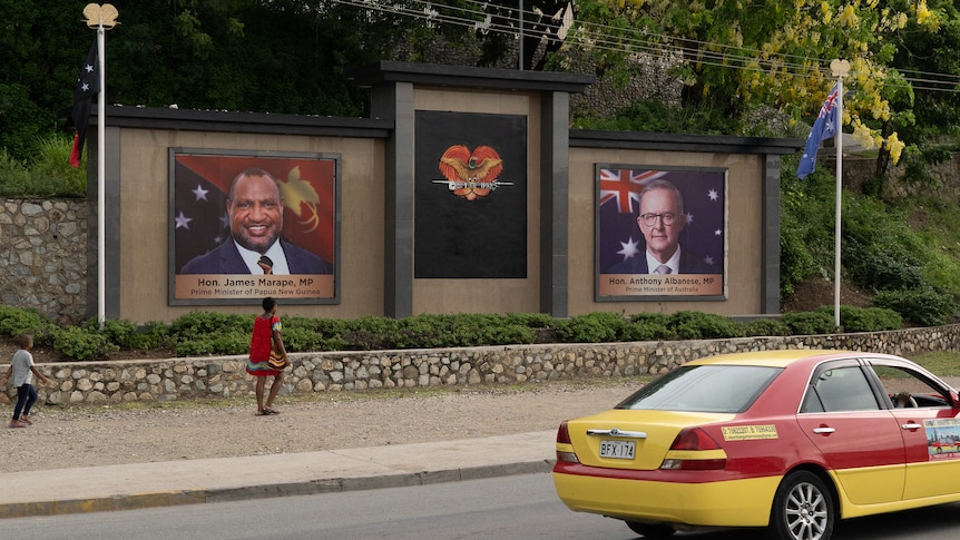 Large billboards showing PNG PM James Marape and Australian PM Anthony Albanese