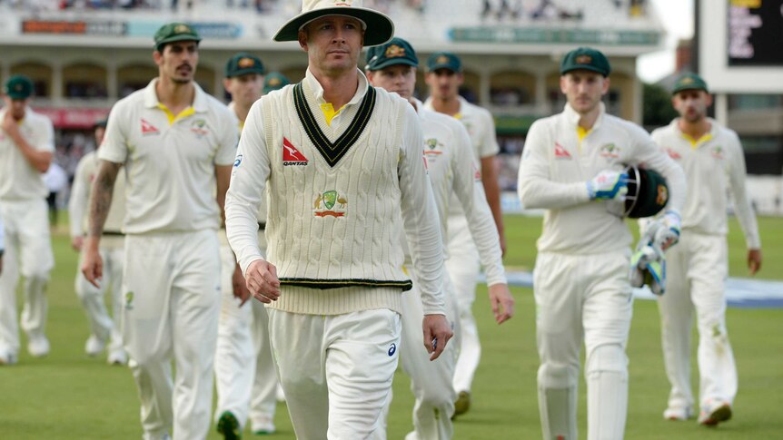 Australia's captain Michael Clarke leads his team off after day one at Trent Bridge.