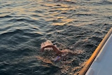 Brendan Cullen swimming alongside a boat in the English Channel. 