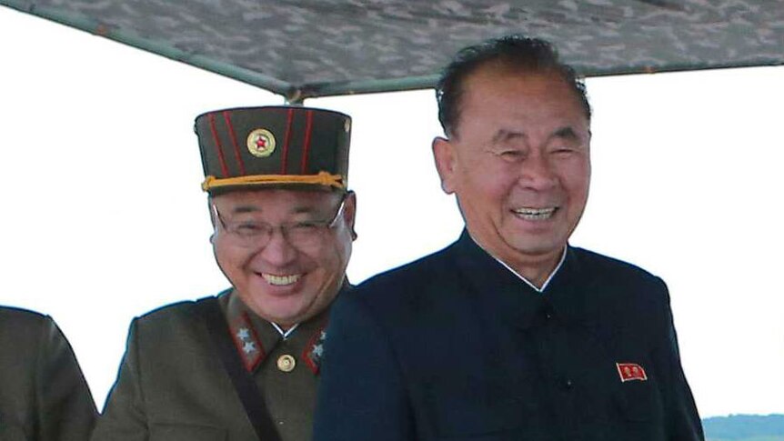 Kim Jong Sik and Ri Pyong Chol stand together.