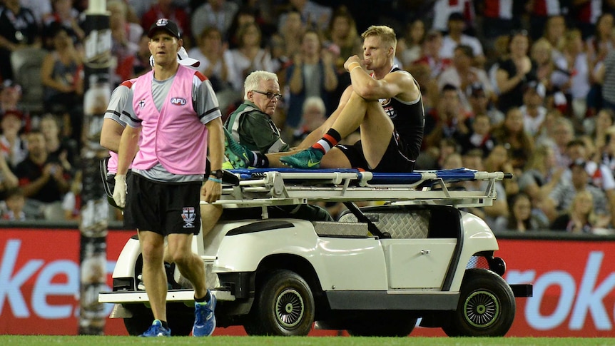 Nick Riewoldt is taken off the field on a medicab