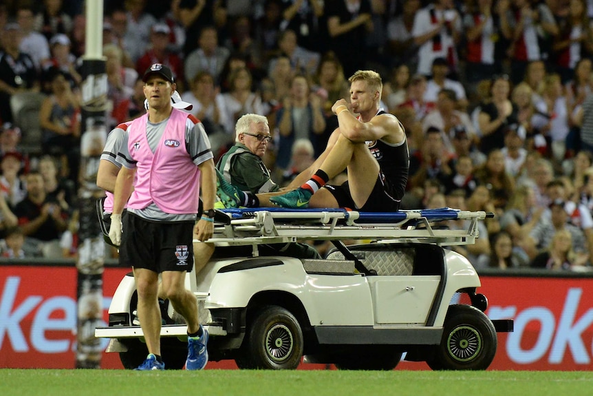 Nick Riewoldt is taken off the field on a medicab