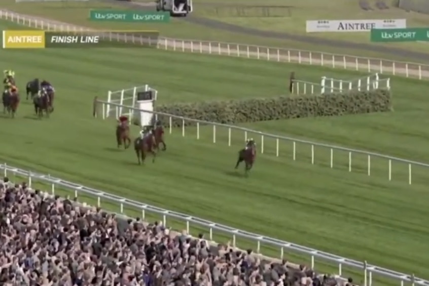 CGI horses run on a virtual race course with spectators in the foreground