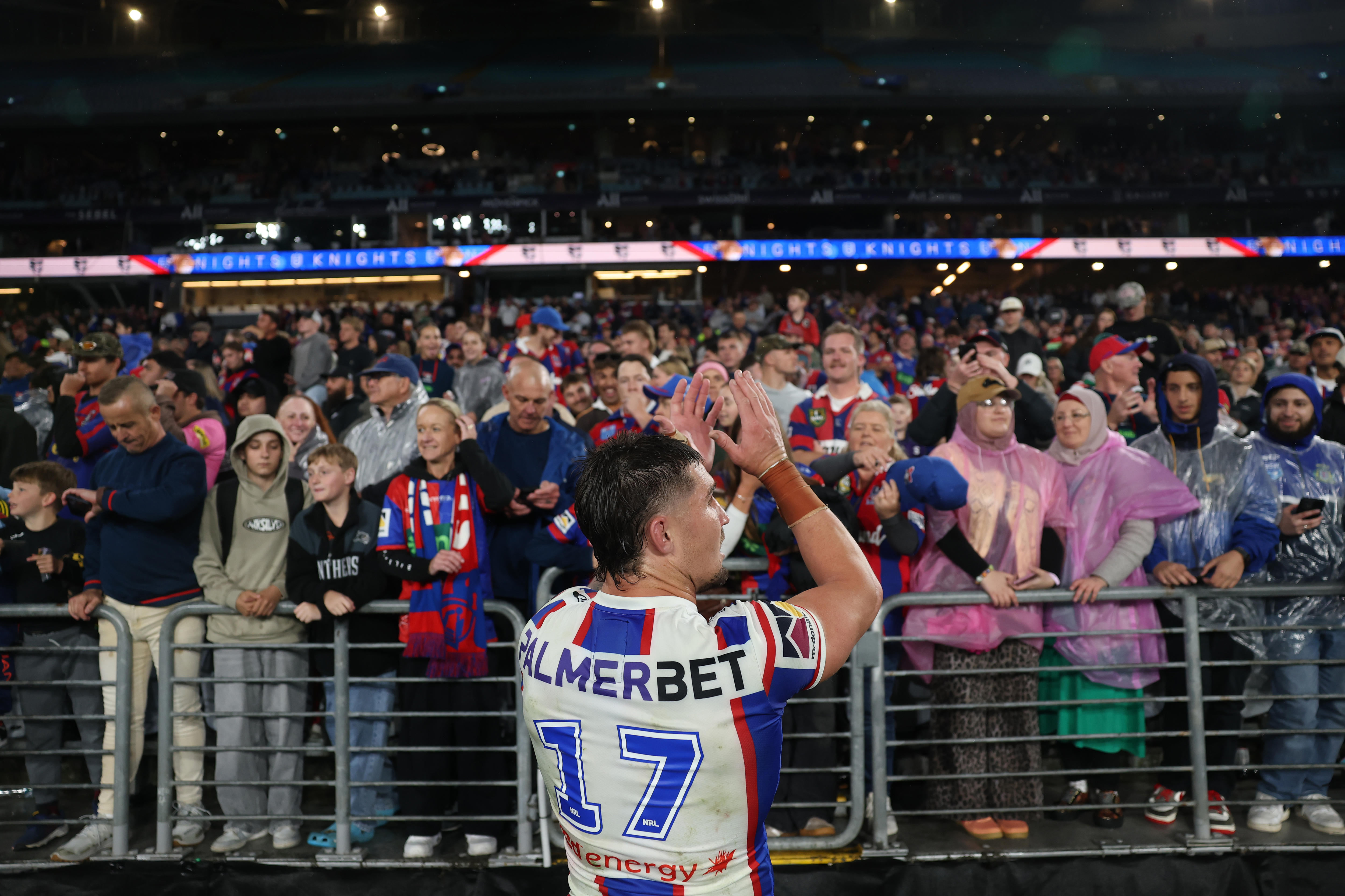 Dylan lucas applauds Newcastle Knights fans.
