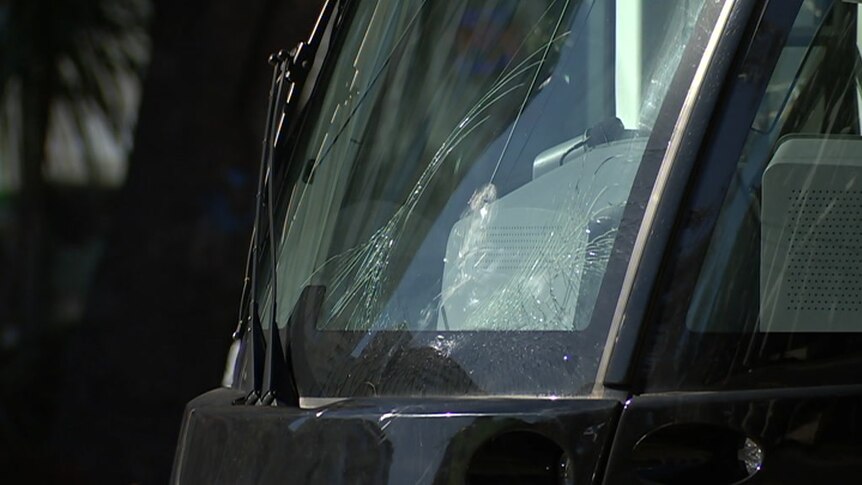 A smashed windscreen on light rail vehicle after it hit a pedestrian.