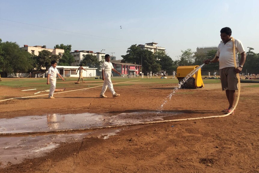 Mumbai's cricket grounds are watered during drought.