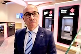 NAB CEO Andrew Thorburn in branch with ATMs