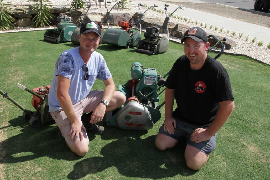 Two mates bond over restoring lawn mowers