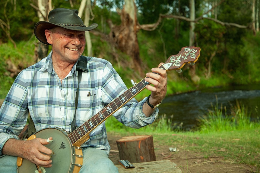 Shane Brooks plays his banjo