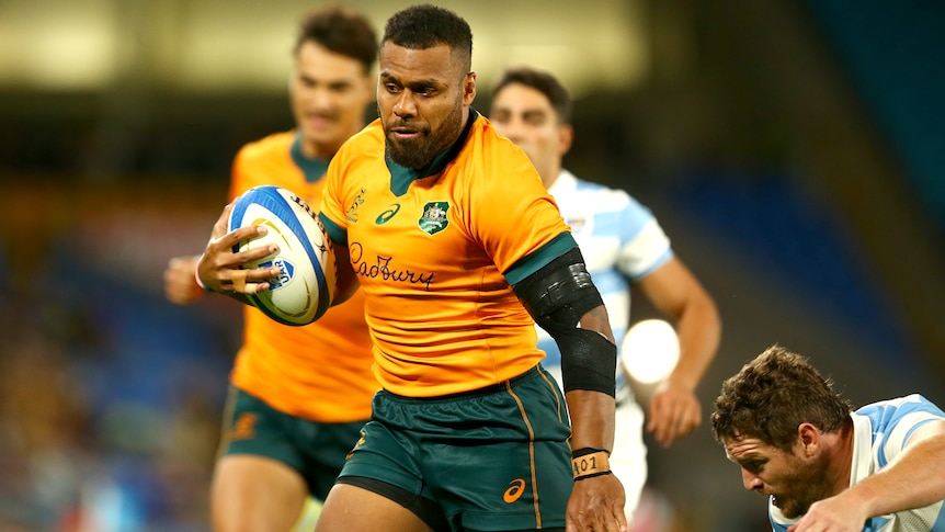 A Wallabies player runs with the ball against the Pumas.