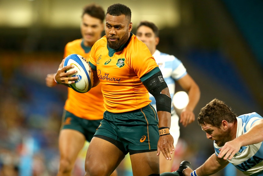 A Wallabies player runs with the ball against the Pumas.