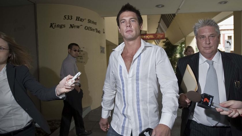 May sue: Ben Cousins and lawyer Shane Brennan outside the Central Law Courts in Perth (File photo)