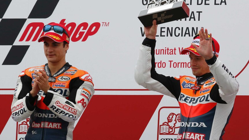 Last goodbye ... Casey Stoner (R) finished on the podium in Valencia in his last MotoGP race.
