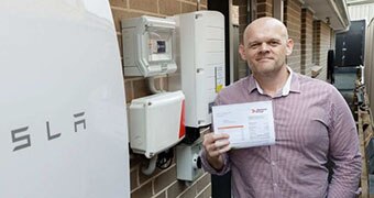 Nick Pfitzner with his Tesla battery