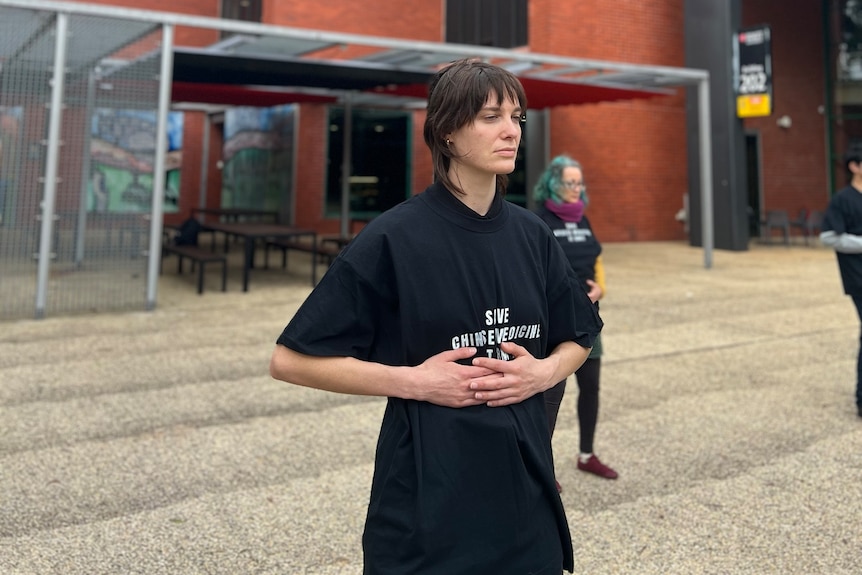 A woman wearing black shirt. 