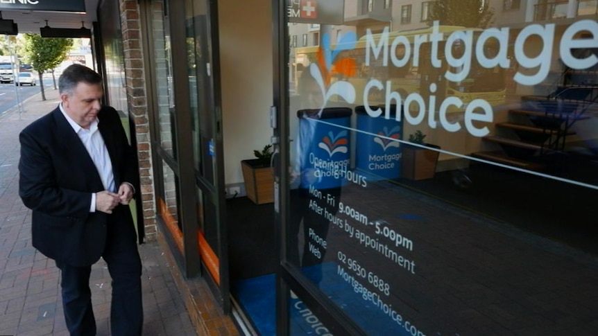Aurelio Tenaglia walks into his Mortgage Choice shop
