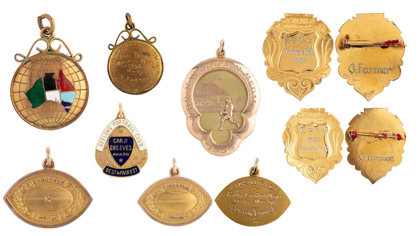An image of AFL best and fairest medals.